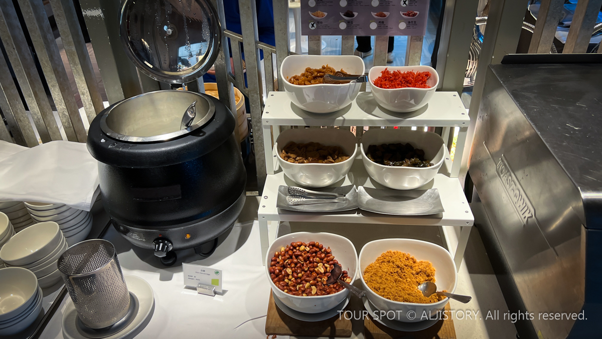 Cereal and various dishes prepared for breakfast at the hotel