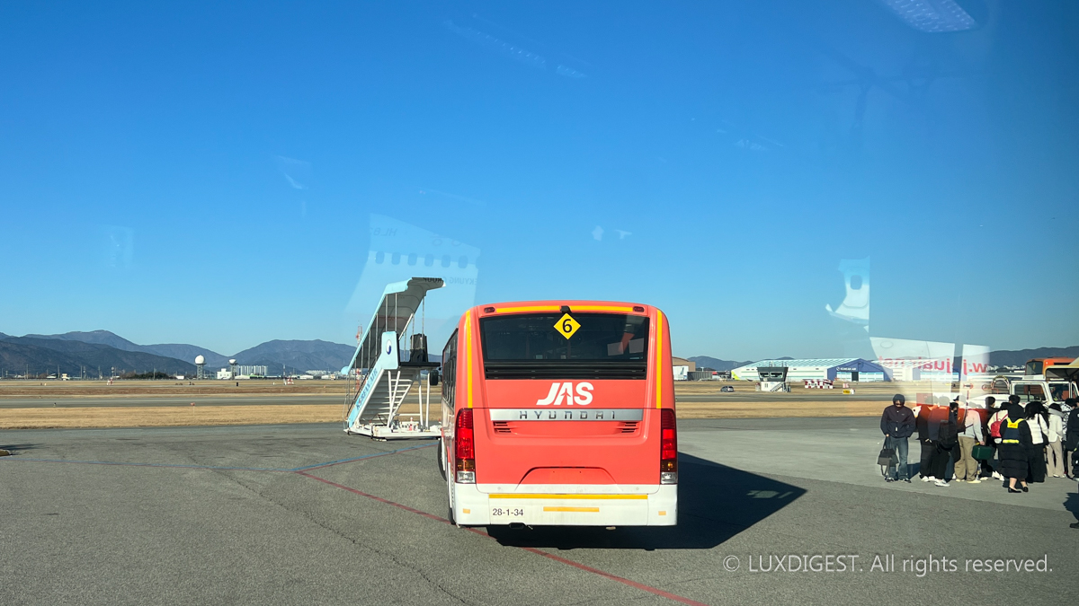 images of people travelling aboard an airliner