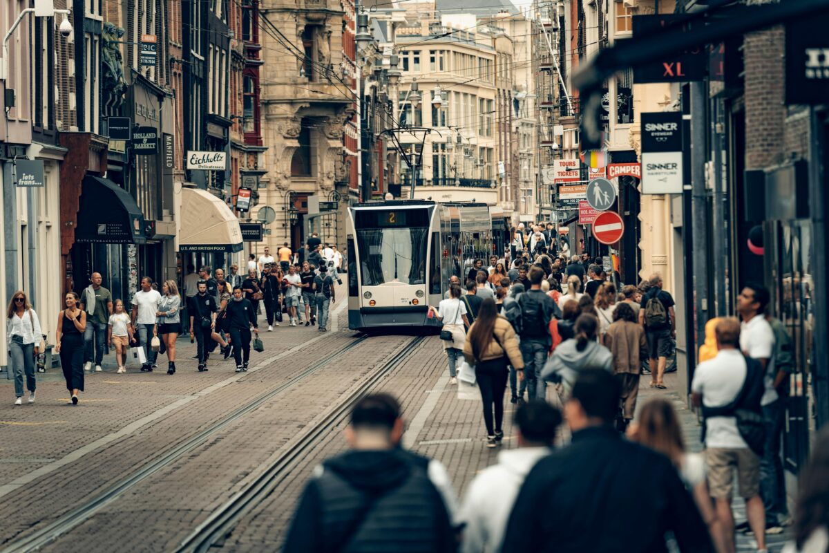 the sight of tourists walking around the streets of the shopping district